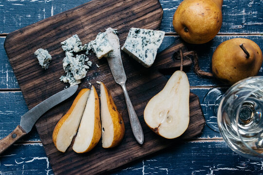 Sliced bosc pear, Gorgonzola cheese and white wine