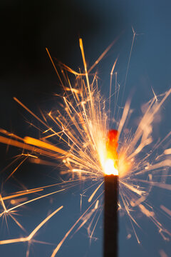 Tip Of Ignited Sparker Against Sky