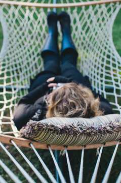 woman rests in a hammock