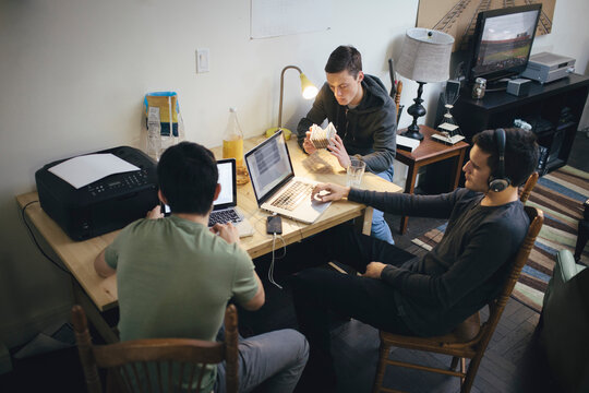 Architecture Students Discussing Structural and Computer Generated Models at Home