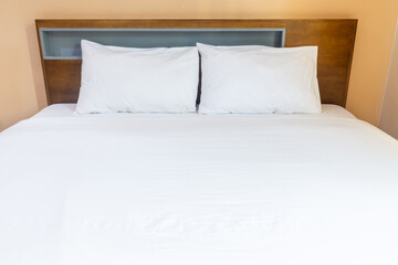 White pillows on a bed Comfortable soft pillows on the bed.