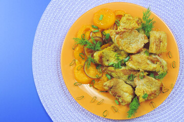 fried spicy meat with vegetables and green onions