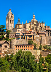 Fototapeta na wymiar Segovia Spain Roman historic hilltop city town with brilliant cloudless blue sky on sunny summer day