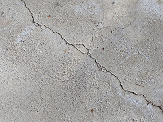 Large Crack Diagonal from Corner to Corner on Concrete Floor or Sidewalk, Damage on Concrete
