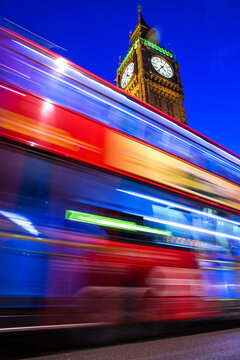 The Night Bus in London passing in front of the Big Ben
