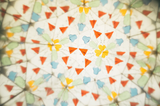 Pieces of colored glass seen through a kaleidoscope