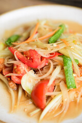 Thai food, Spicy papaya salad (Som Tum) on plate, Close up