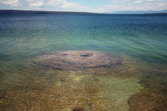 West Thumb Geyser Basin's Fishing Cone at the edge of Yellowstone Lake in the national park