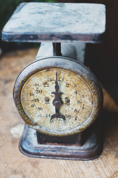 An old scale sits on a counter