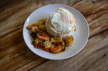 Stir Fried Seafood with Chili Paste and fried egg Thai food