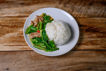 Stir Kale with crispy belly pork Thai food