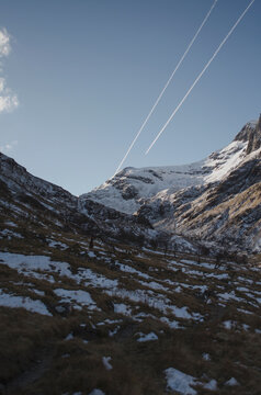 Plane Trails over Mountain Peak