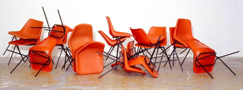 Messy Pile Of Orange Chairs (Chair Orgy)