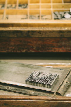 Lead Press Types on a Wooden Desk