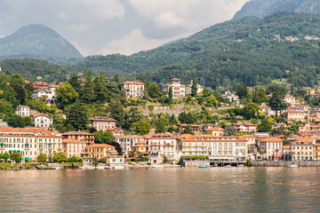 Fototapeta na wymiar Panorama of Menaggio Town on Lake Como in Italy. Bright Architecture with Colorful Buildings.