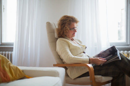 Senior Woman Reading a Magazine