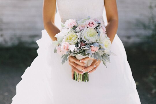 Stock photo of a bride holding her bouquet