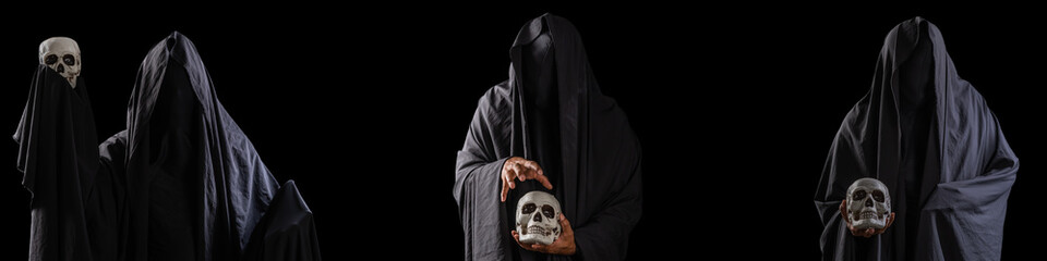Group of three scary mysterious black man holding a skull in his hand isolated on black background