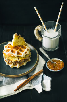 Typical breakfast table with milk and waffle