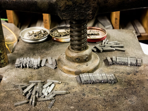 Lead press types on a vintage printing press