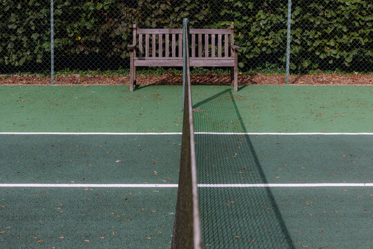 Bench at the end of the centre line of a tennis court