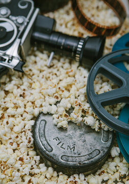 Cinema cameras, reels and popcorn.