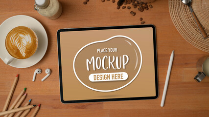 Mock up tabletop wooden table with coffee cup, stationery, accessory and decorations