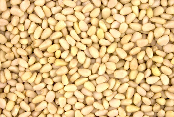Background texture of shelled pine nuts.