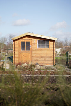 Simple wooden cabin in a garden