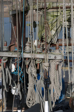 Ropes and knots on the side of a fully rigged old sailing ship