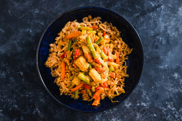 plant-based food, vegan ginger noodls with stir fried veggies in green curry sauce