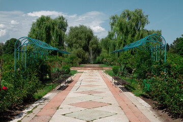 a beautiful place to relax with benches and a large fountain. Rose bushes grow everywhere