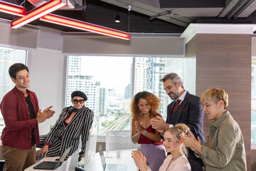 Diverse ethnicities in a business office. Workers from different races discuss and support each other for great success. Gender equality in private office