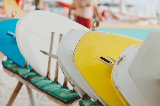 Rows of surfboards at beach