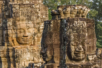 serene and smiling stone faces on towers of Bayon Temple, Angkor, Cambodia