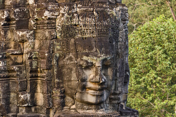 serene and smiling stone faces on towers of Bayon Temple, Angkor, Cambodia