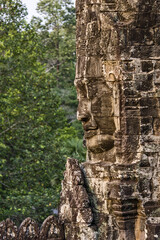 serene and smiling stone faces on towers of Bayon Temple, Angkor, Cambodia