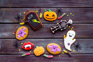 Set of Halloween cookies with candies flat lay, overhead view