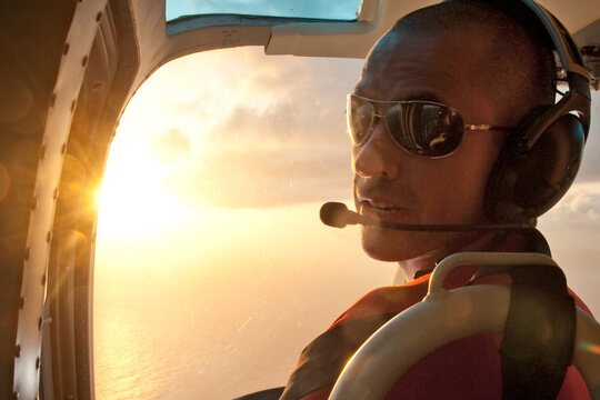 Person inside helicopter against sunset. Venezuela