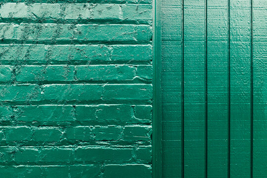 Detail of painted green brick wall