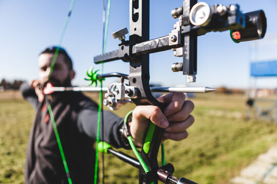 Male Archer Aiming with Professional Compound Bow