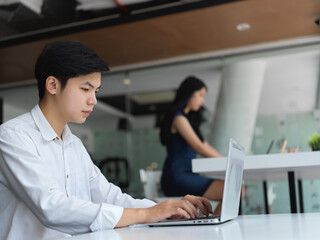 Cropped shot of young group of businesspeople working on their project with laptop computer