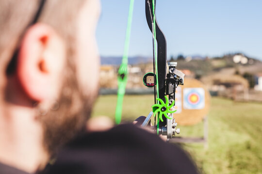 Archer Aims at Target with Viewfinder