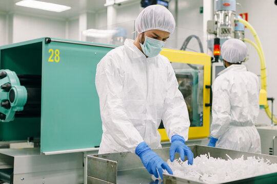 Two male engineer working in a factory.