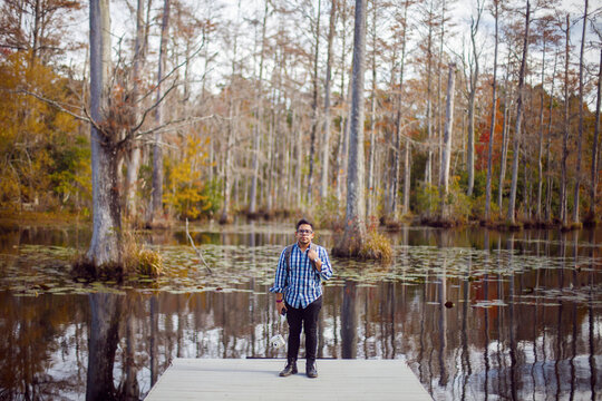 Attractive Hispanic Man Standing On A Swamp Boat Launch Pad