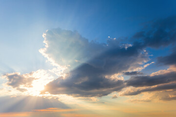 dramatic sunset among a dense cloudy sky, beautiful natural sunset background