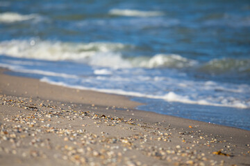 closeup sandy sea beach with vawes