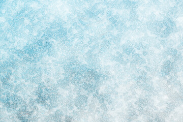 The surface of the earth is covered with snow. Frost texture iced surface - Winter material. Texture of ice. Snow texture. Cracked ice background. Abstract frozen water.Ice texture winter background.