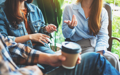 A group of young people sitting and talking together