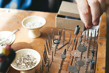close up of tools on a jewellers work bench / studio